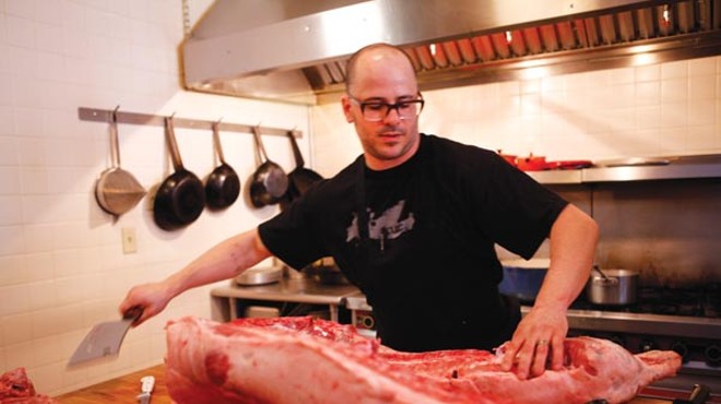 Cure's Justin Severino offers hog-butchering demonstrations, with a meal
