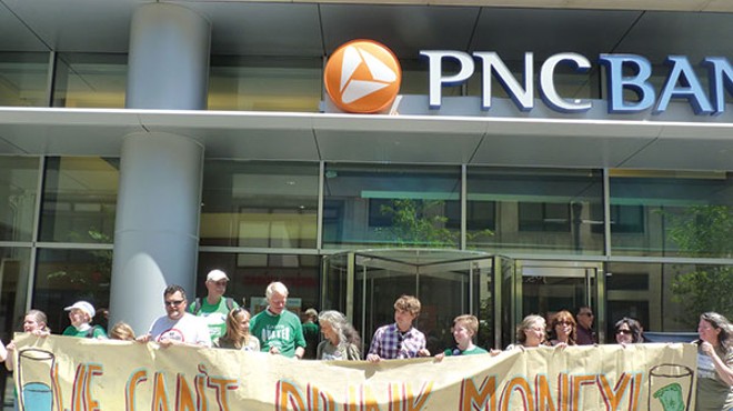 Members of the Earth Quaker Action Team protest PNC in May 2012