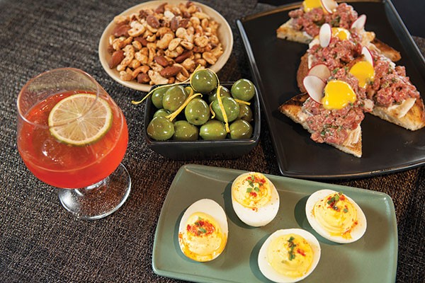 Mexican War Streets cocktail, spiced nuts, Castelvetrano olives, deviled eggs and beef tartare