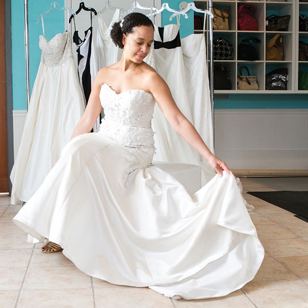 Tracy Mahood models a wedding dress available at Style Exchange Boutique