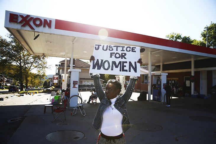Community activists protest the alleged assault of two Black women customers at a Marshall-Shadeland gas station
