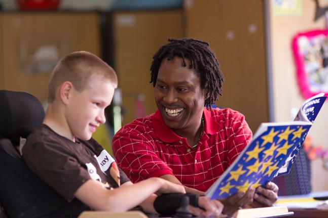 Photo of student with Teacher's Aide at The Day School at The Children's Institute of Pittsburgh