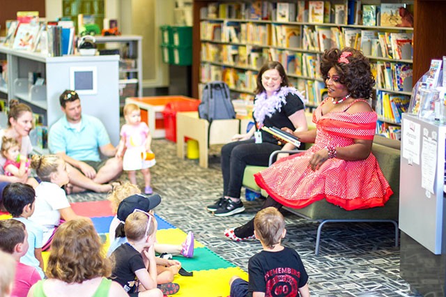 Akasha L Van-Cartier reads to kids at Drag Queen Story Hour