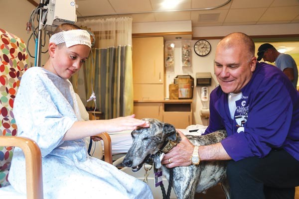 Pet therapy: David Anderson and Lulu visit patients at Children's Hospital