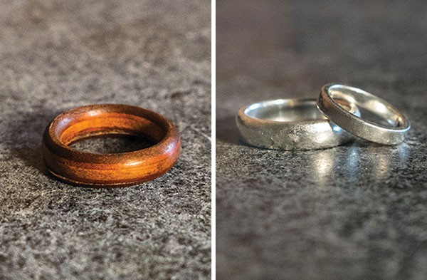 Amy and Ian Green's original $35 wooden wedding ring, and their custom-made silver wedding bands