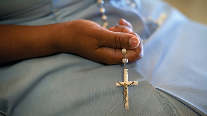 A devout Pittsburgh Catholic attends Mass following report on clergy sex abuse