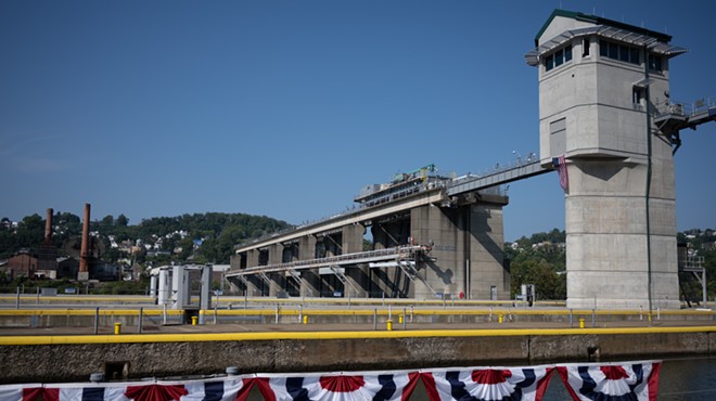 A massive concrete gated dam