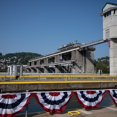 A massive concrete gated dam