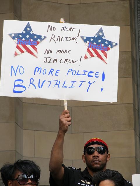 Activists protest reinstatement of officers in Miles beating