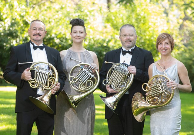 Members of the American Horn quartet pose for a group photo.