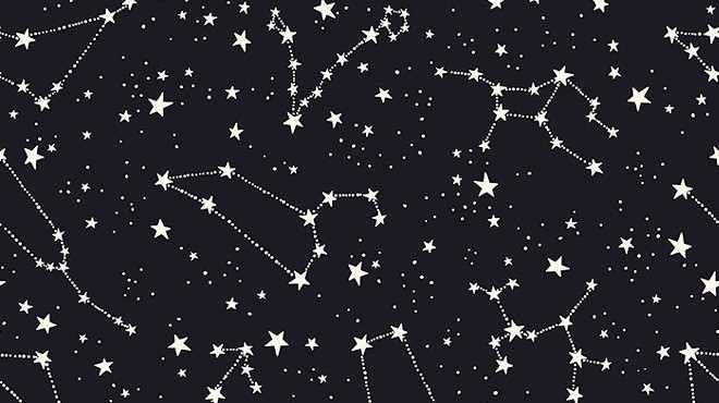 White stars and astrological signs on a black background