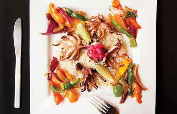 Grilled baby octopus in guajillo chile and garlic oil with coconut rice and fajita-style vegetables