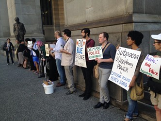 Protesters turn out for city's opening case in police contract arbitration