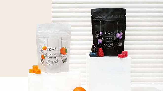 Photo: two bags of evn gummies, one is a white bag marked "sativa" with citrus imagery, and the other a black bag marked "indica" with purple berry imagery.