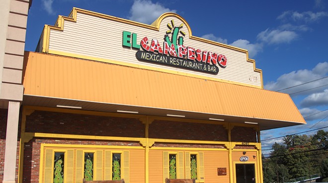 The exterior of a building with a sign that says "El Campesino"