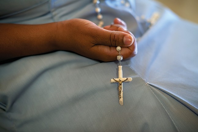 A devout Pittsburgh Catholic attends Mass following report on clergy sex abuse