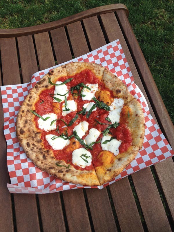 Wood Fired Flatbreads is a traveling enterprise specializing in super-fast pizzas