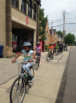 School kids learn to ride through the city streets thanks to Bike PGH’s Positive Spin