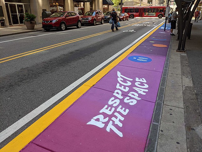 Downtown Pittsburgh bus stop reopens with "Respect the Space" art installation by Janel Young