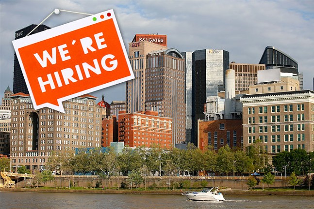 A sign that says "we're hiring" is Photoshopped on top of a photograph of the Downtown Pittsburgh skyline