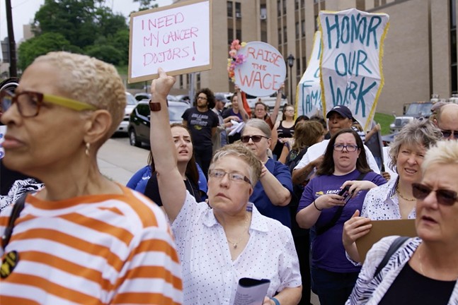 A scene from the documentary InHospitable shows a group of hospital workers and patients protesting UPMC in Pittsburgh.