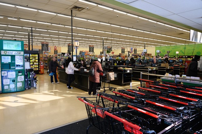 Shoppers in a large grocery store.