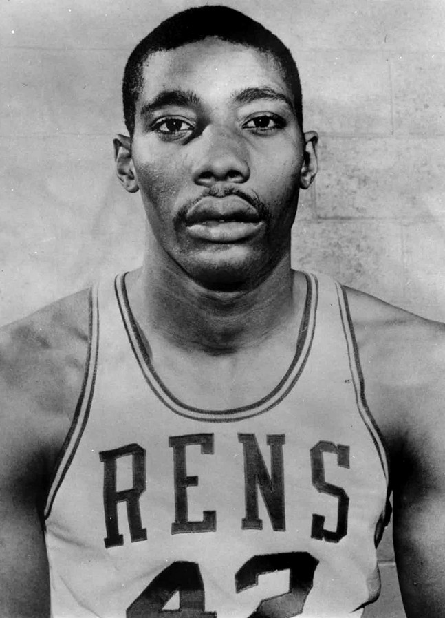 A man with brown skin and a mustache poses in a jersey reading "RENS"