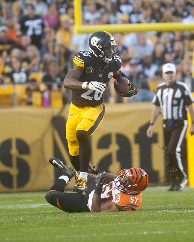 Cincinnati Bengals Vincent Rey (57) celebrates after his team