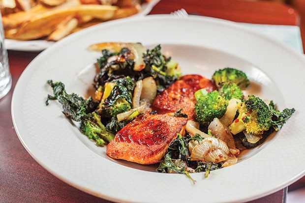 Seared salmon with an Asian-style glaze, sautéed greens and broccoli