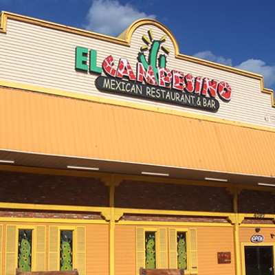 The exterior of a building with a sign that says "El Campesino"